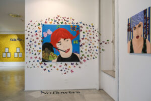 “No Flowers” Installation - 2021 (“Breakfast at Pippi’s” 2002 + paper butterflies + "No Flowers" written) and "No Water $wimming Poor" acrylic on canvas - 60x60 cm - 2014. Roxy in the Box - PAN 2021-2022, Napoli.